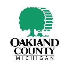 Logo of Oakland County, Michigan, green tree.