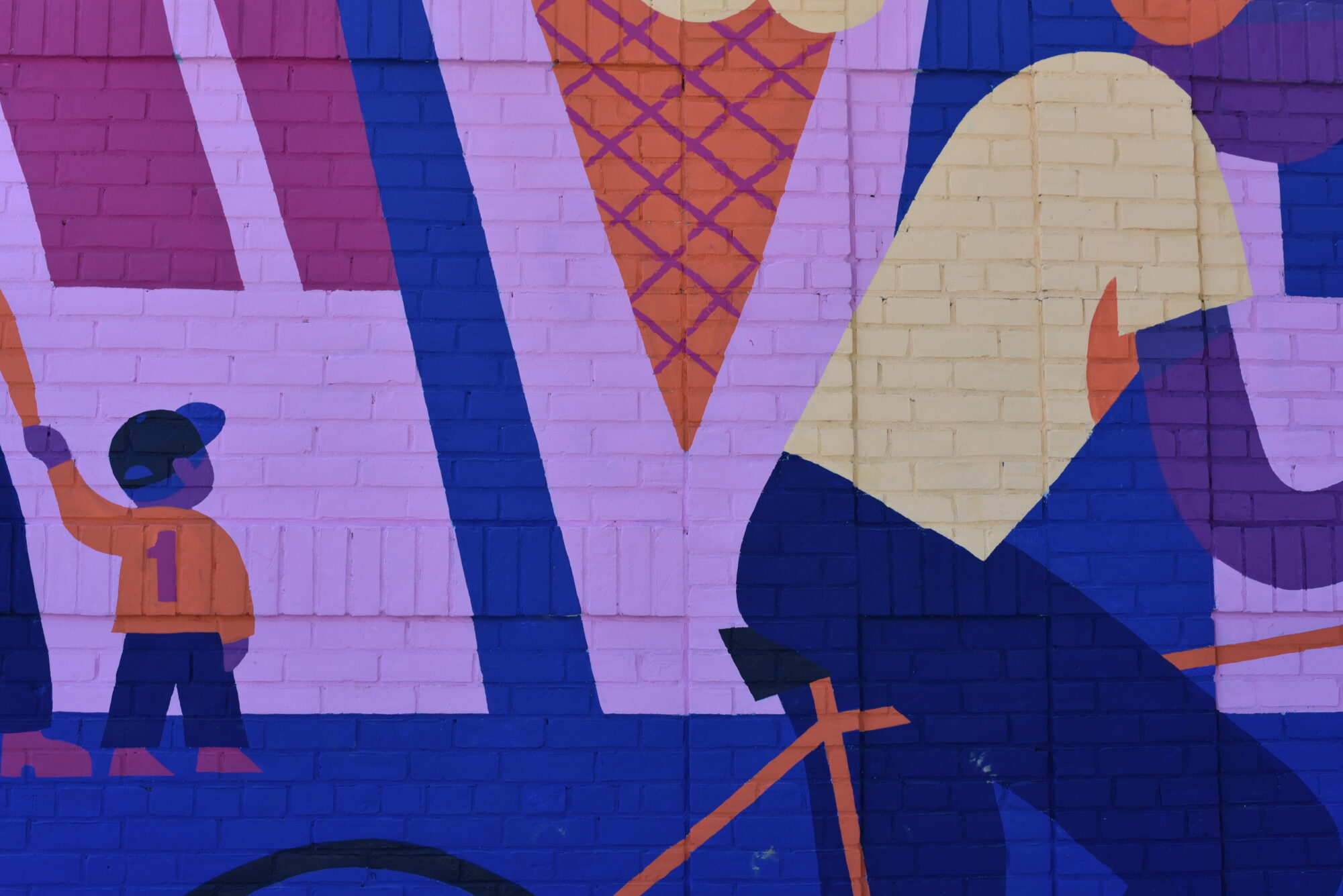 Colorful mural of people and ice cream cone.